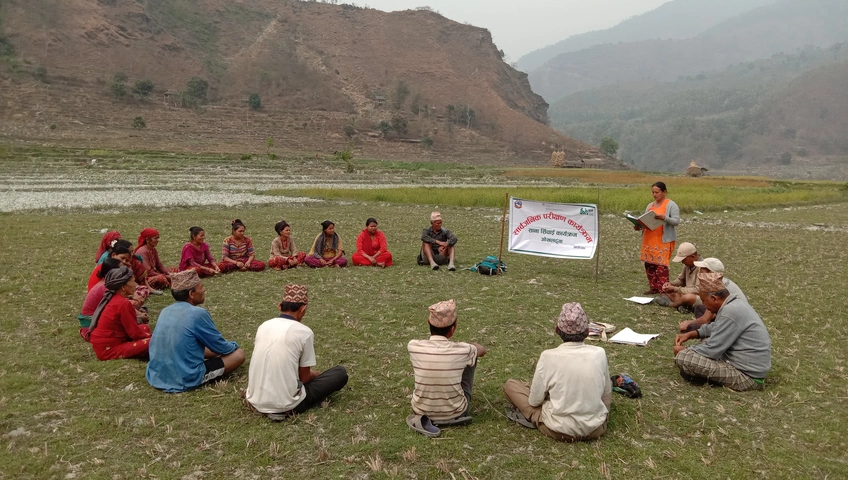 20 People sitting in a circle for a publica audit in Nepal