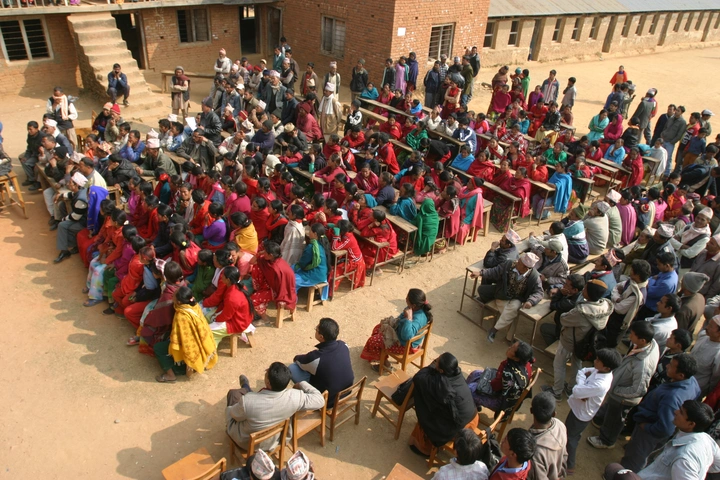 About 150 men & women at a community meeting in Nepal