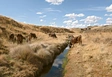 Vorschau Der Fluss in Espinar, der mit Schwermetallen aus dem Bergbau kontaminiert ist.